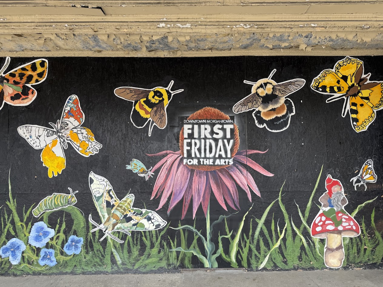 Painted wall with bees and flowers.